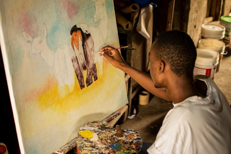 Painter at work with a brush